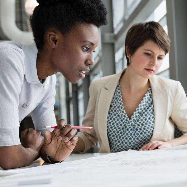 Qlarant Quality Improvement Image - Two Women looking at Plan