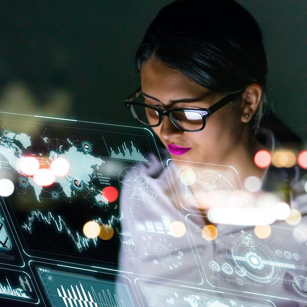 Qlarant Data Science & Technology Image - Woman looking at digital display