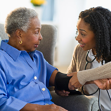 woman getting blood pressure taken