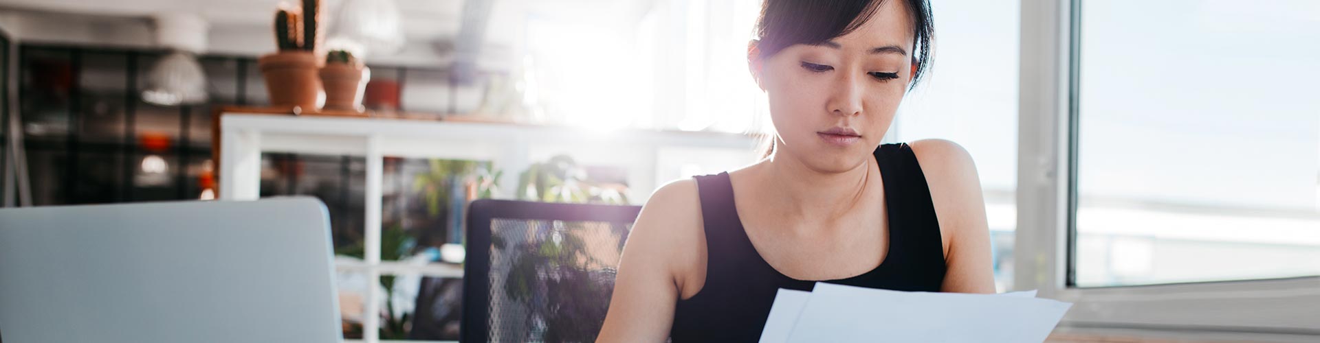 woman looking at papers