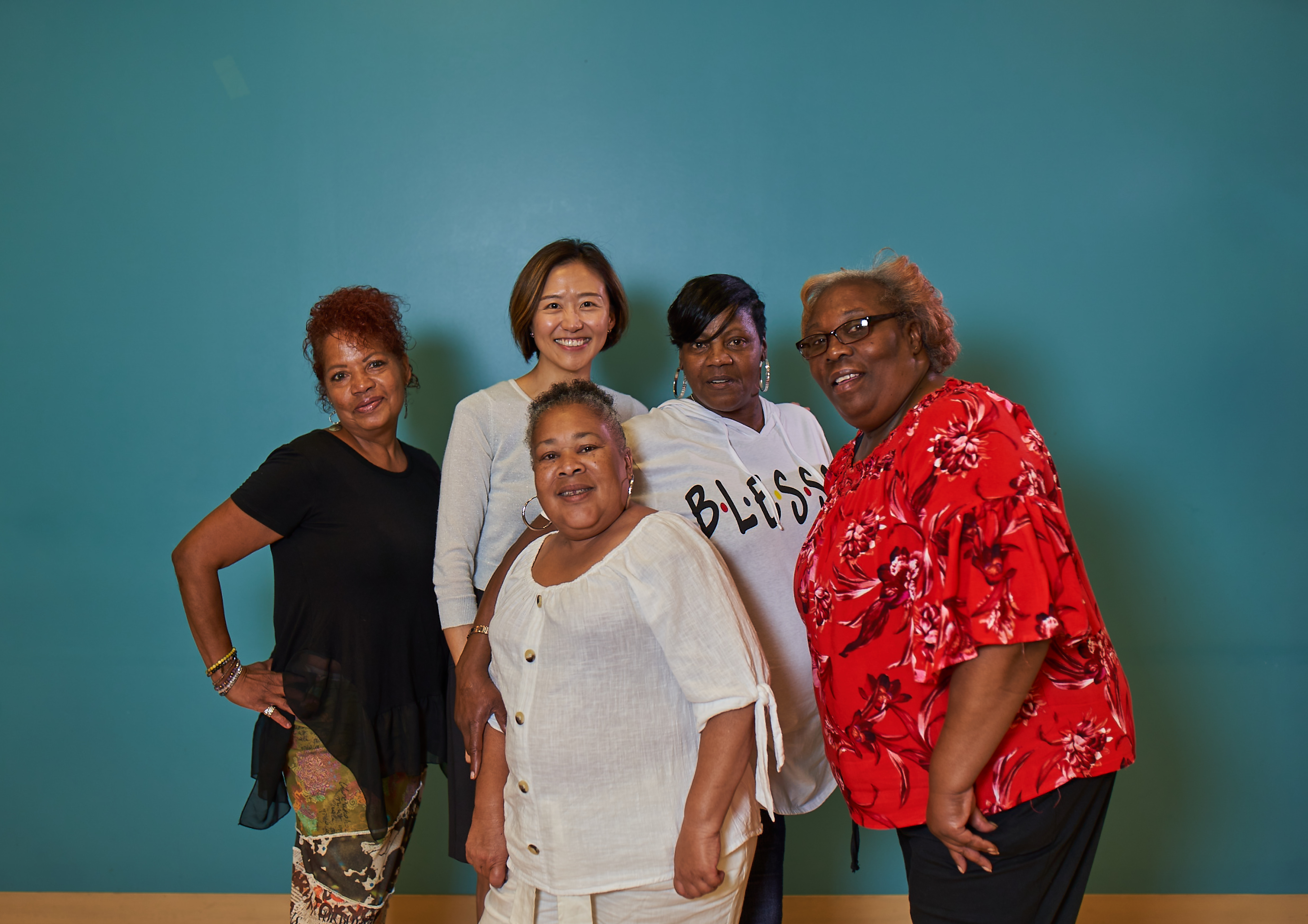 a group of women posing for the camera