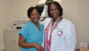 Two female medical providers posing for the camera
