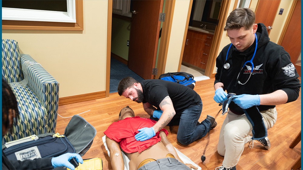 Chesapeake College Student practicing on a medical manikin