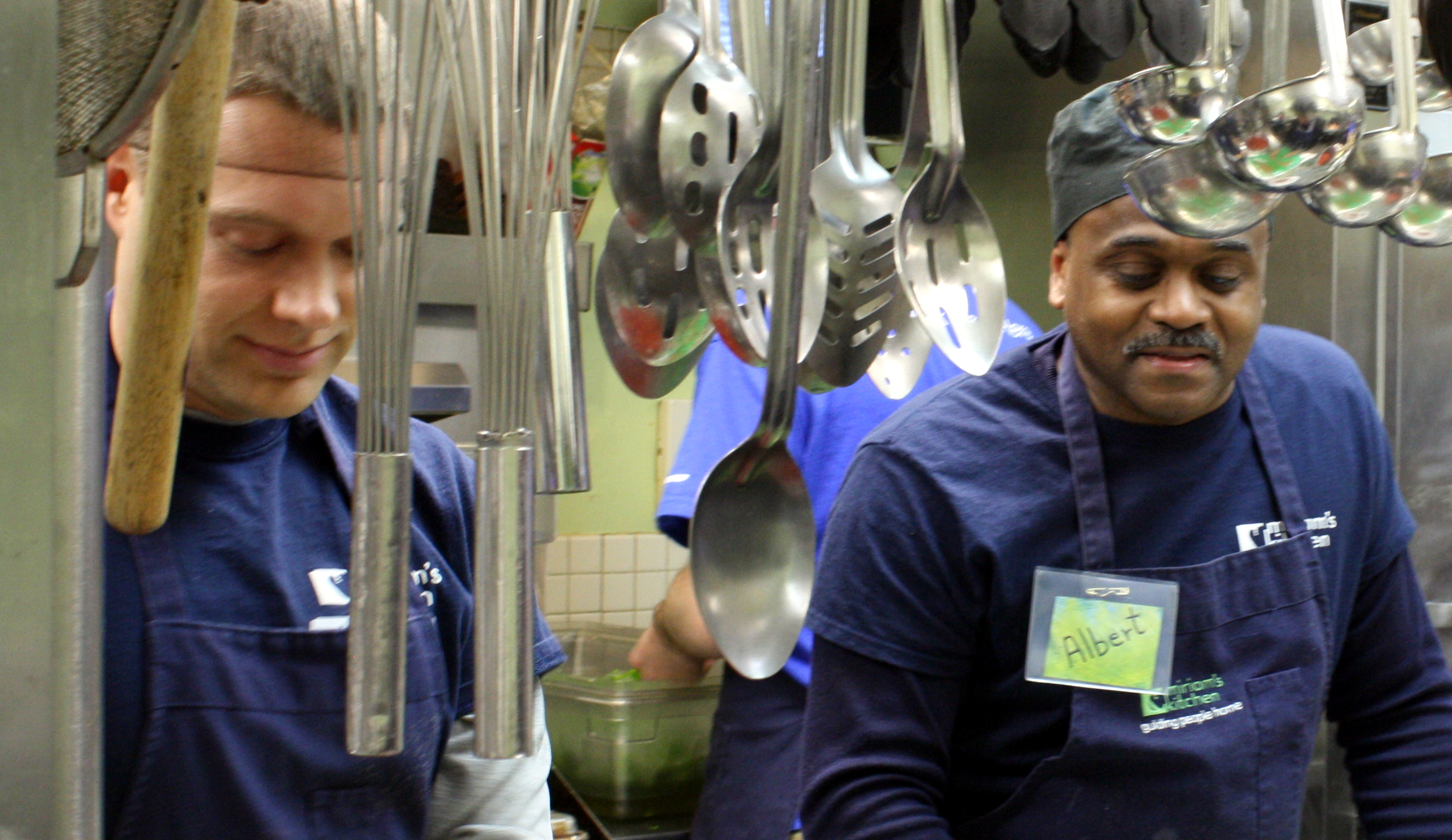 Two men working in a industrial kitchen