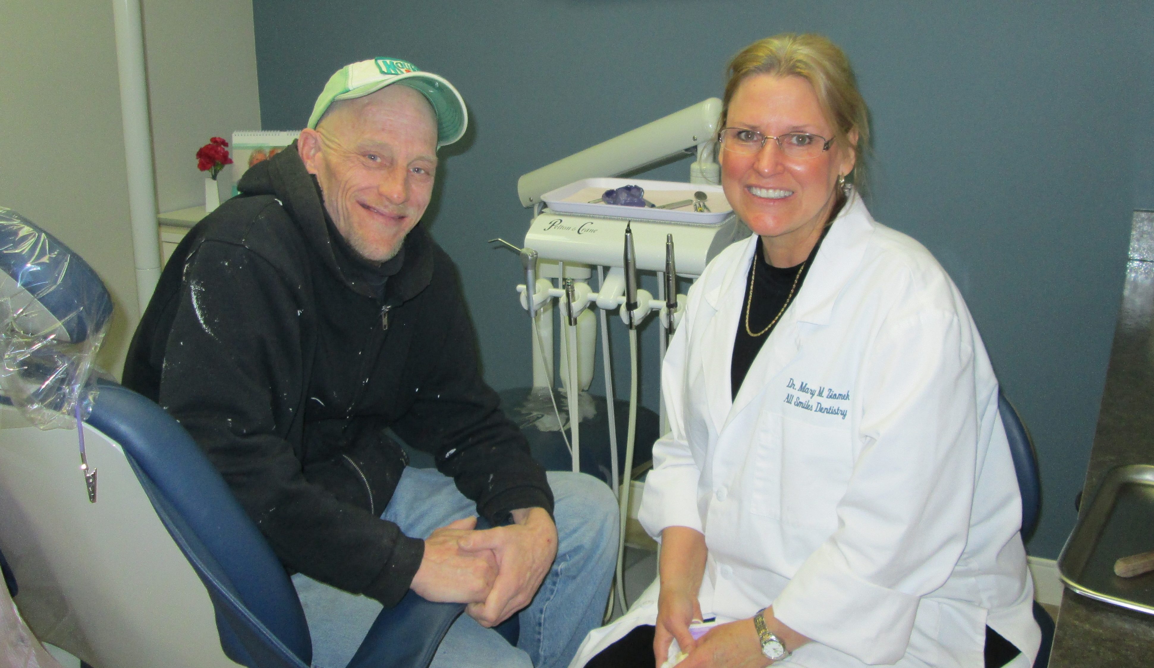 Dentist with a happy patient