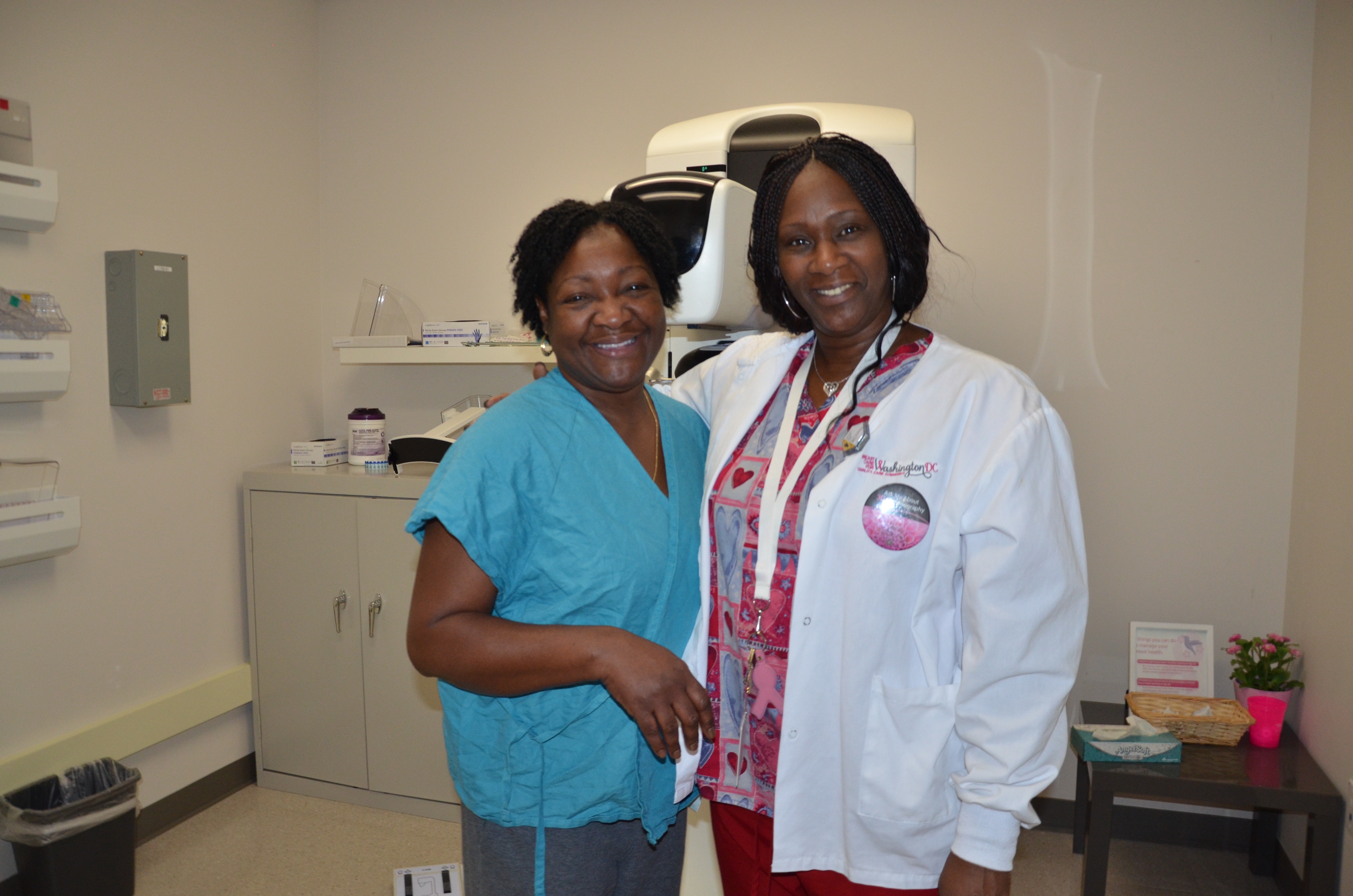 two black female medical providers posing for the camera