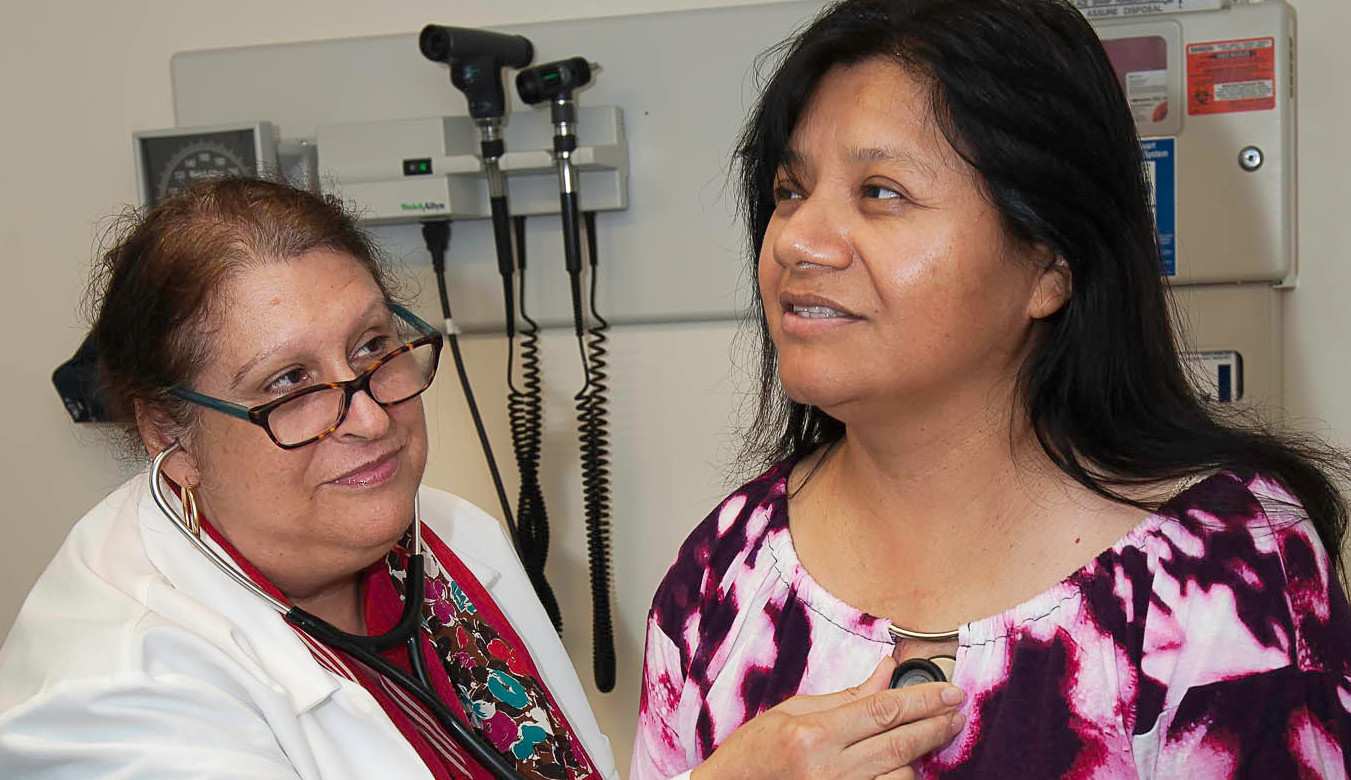 Medical professional listening to the heart of a patient with a stethoscope