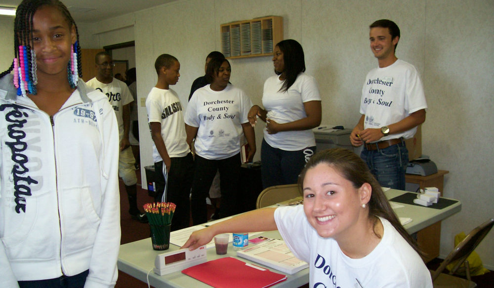 Volunteers working at an event at a table