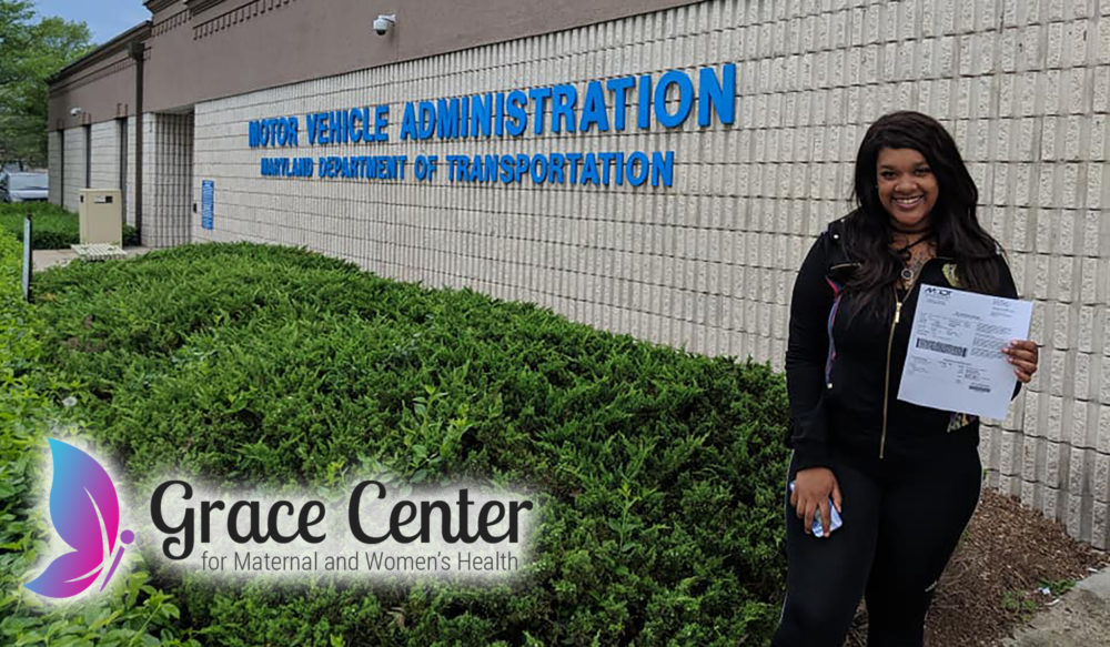 Young woman smiling outside of the DMV