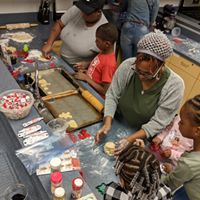 A group of people learning cooking