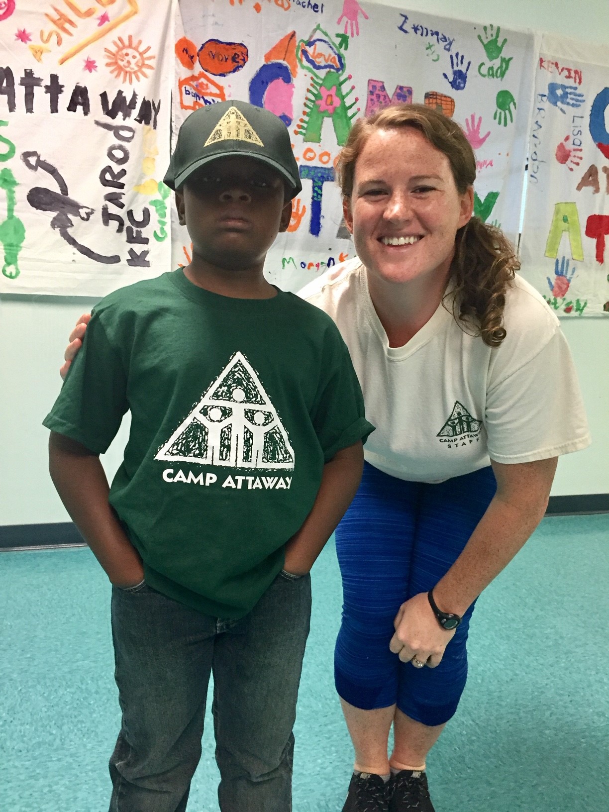 a child posing with a counselor