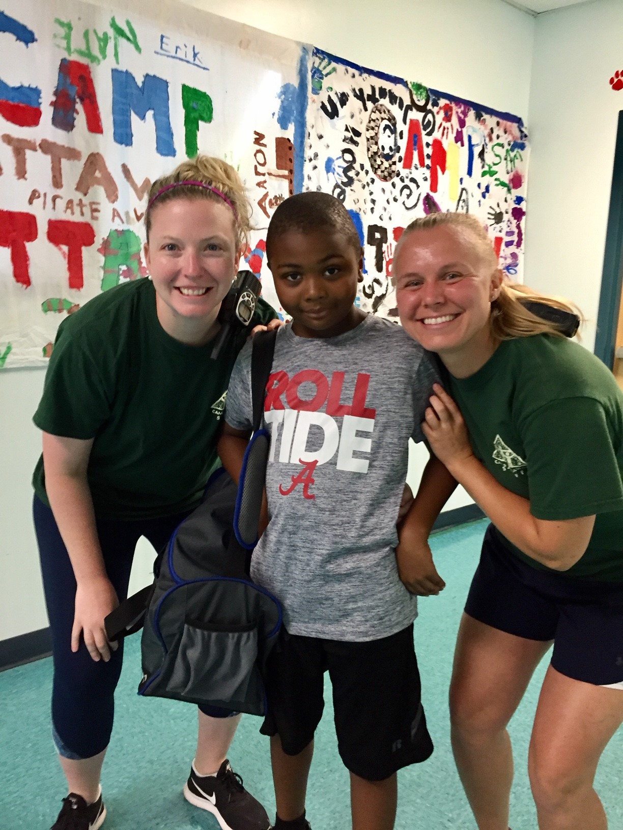 three people posing for a photo