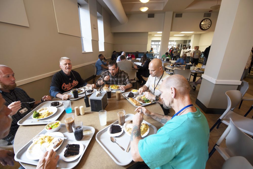 a group of clients eating together