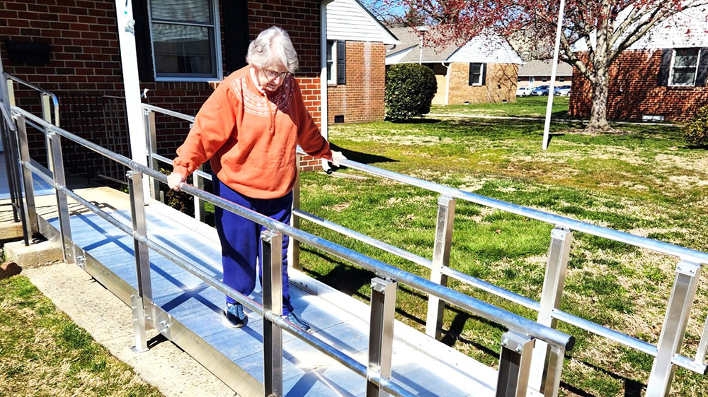 A client walks down her new ramp