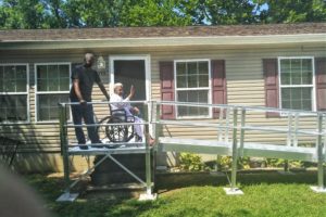 Bay Hundred ramp on a home with homeowner waving