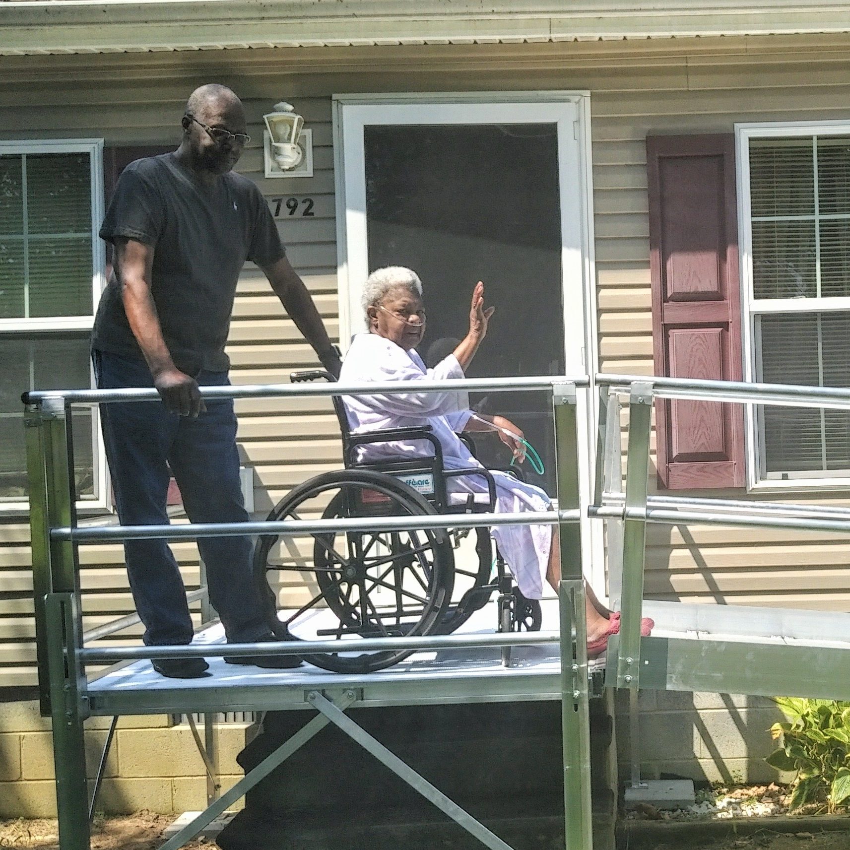 Bay Hundred ramp on a home with homeowner waving