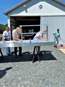 Workers assemble a ramp at Bay Hundred Community Volunteers