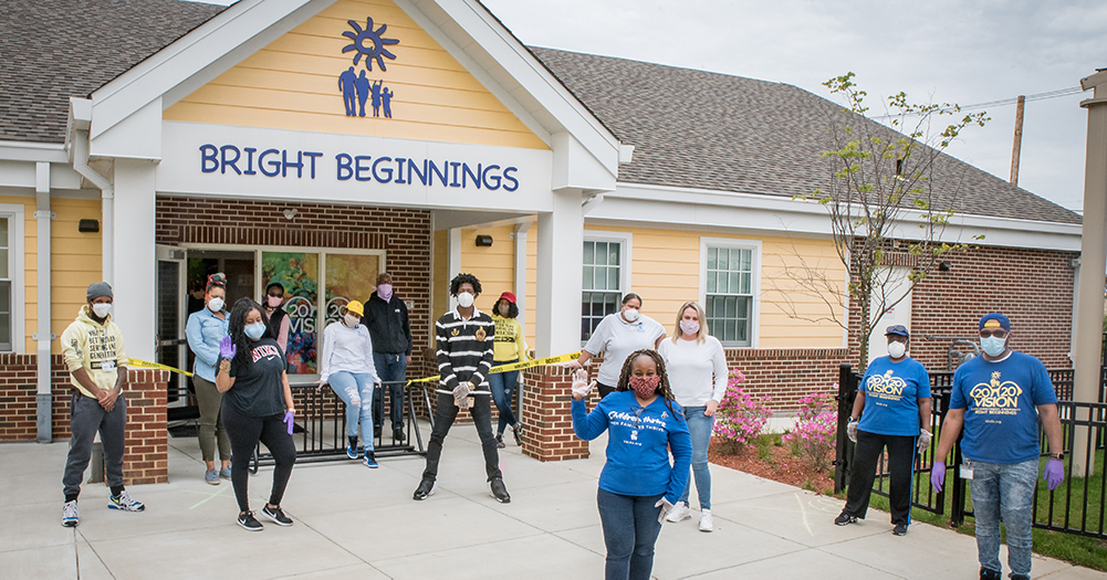 Group of workers standing in front of Bright Beginnings building