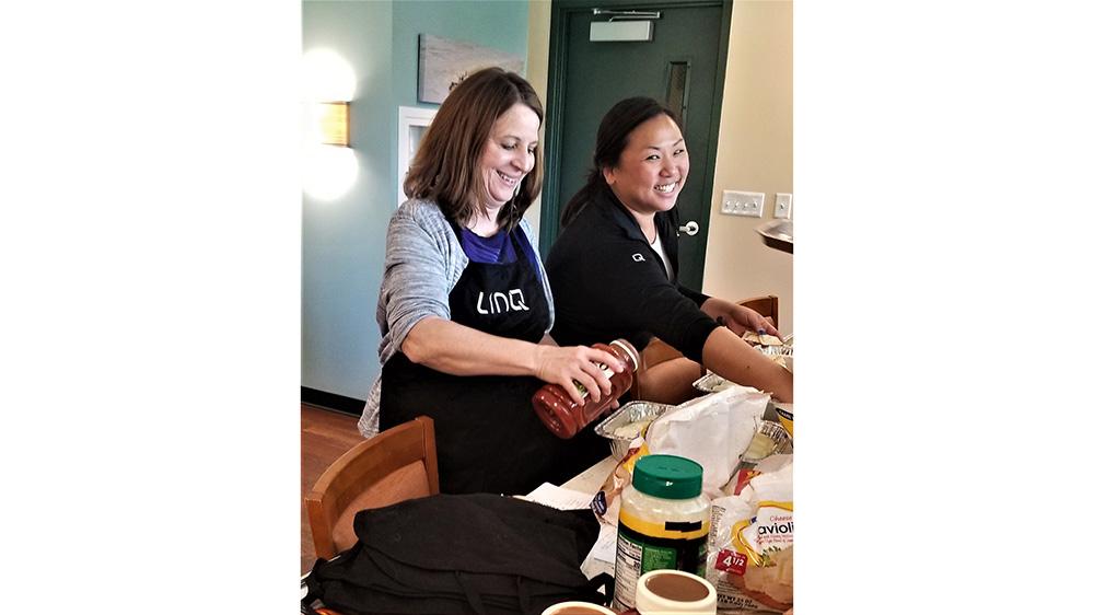 Women preparing food at a table