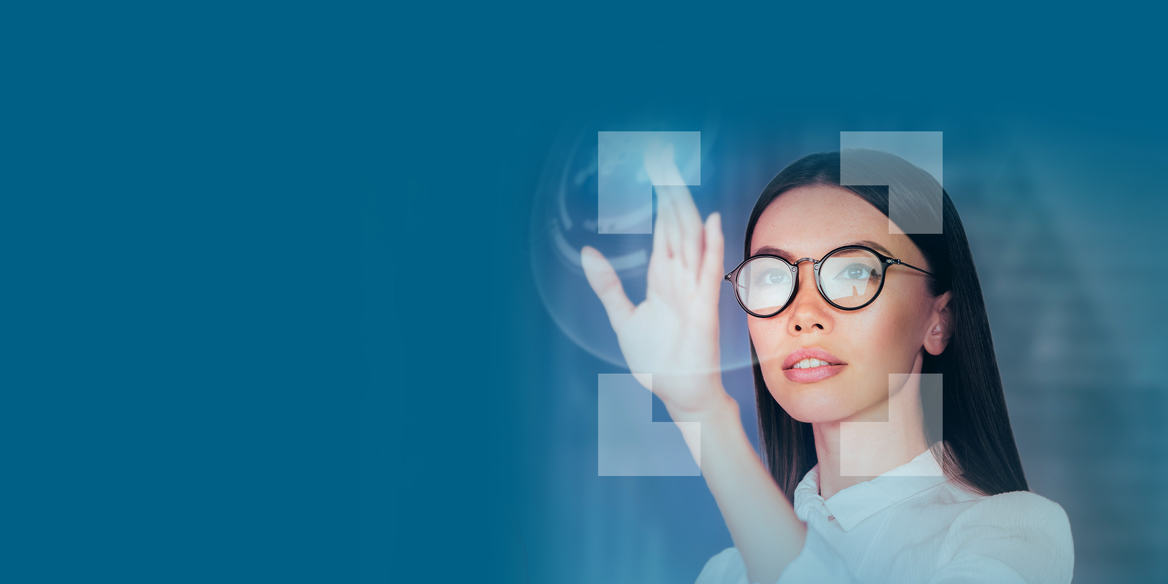 Woman with glasses reaching up to touch visual data and Qlarant viewfinder