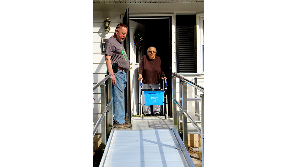 A client sees her new wheelchair ramp