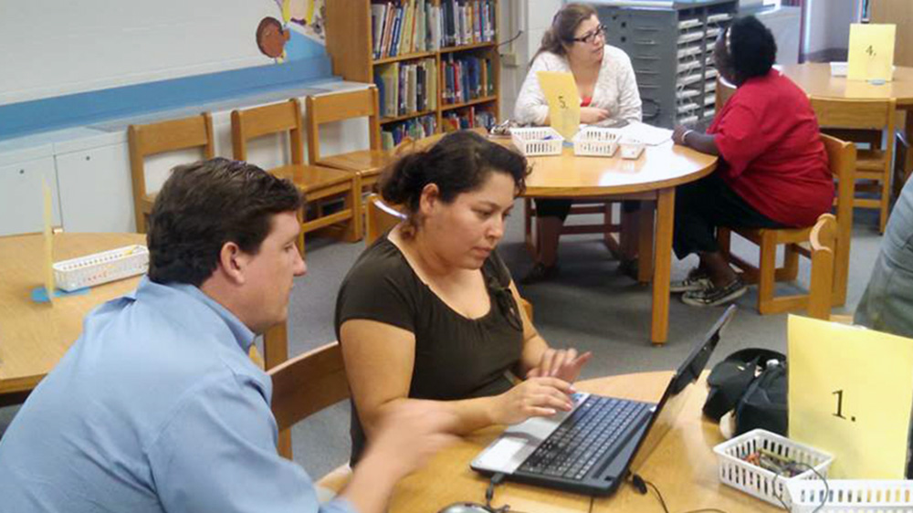 Clients and workers paired up at tables