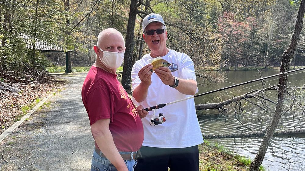 Two men fishing.