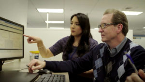 Two associates analyze data together