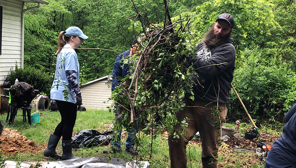 Volunteers clearing brush