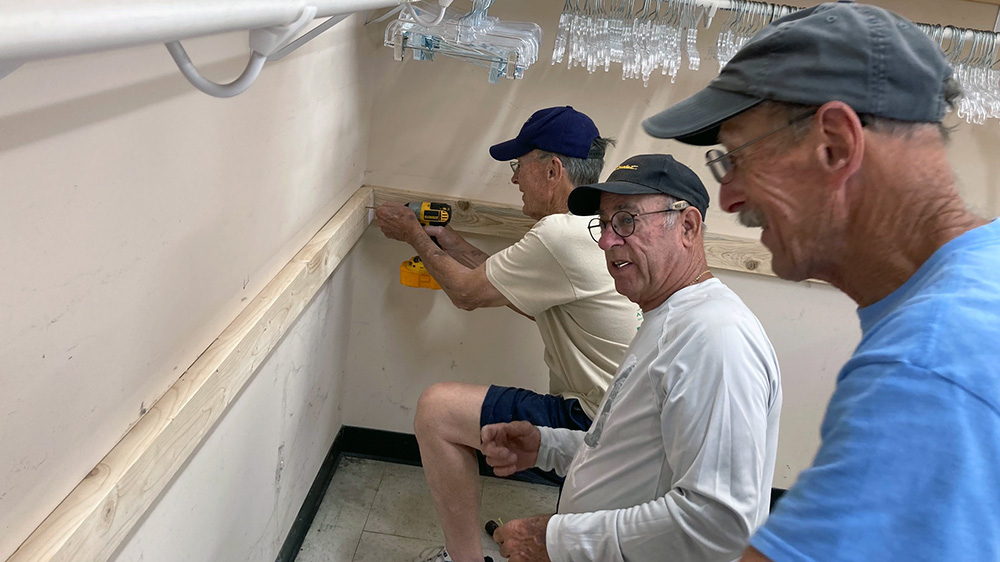 Volunteers working in a closet