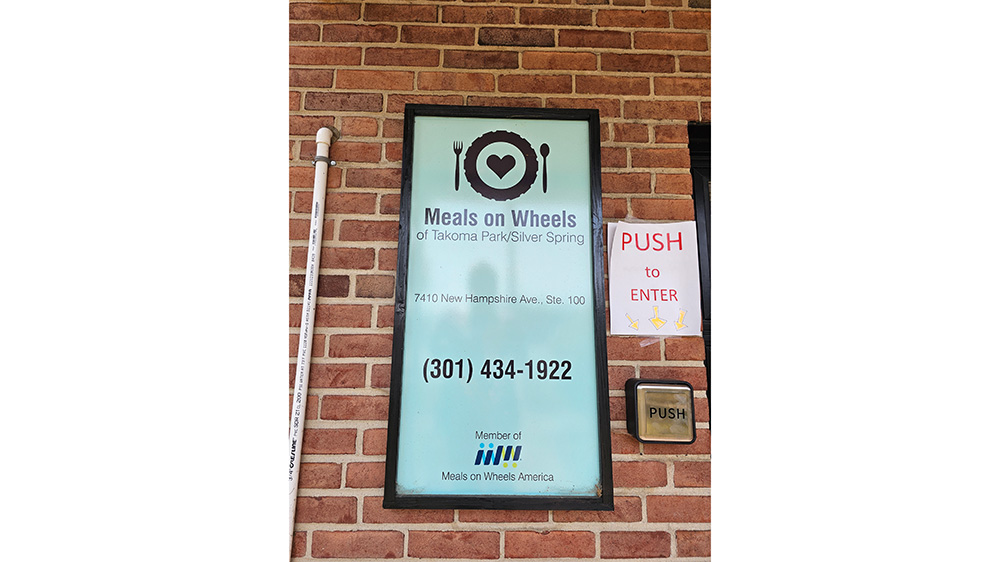 The Meals on Wheels sign on the building