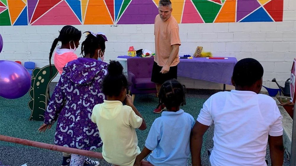 Kids being led in a group activity