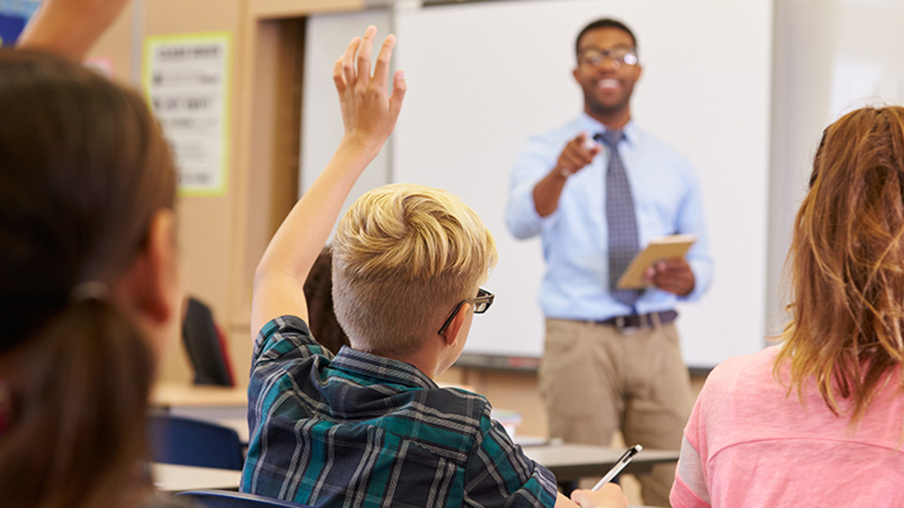 Child being called on by teacher in class