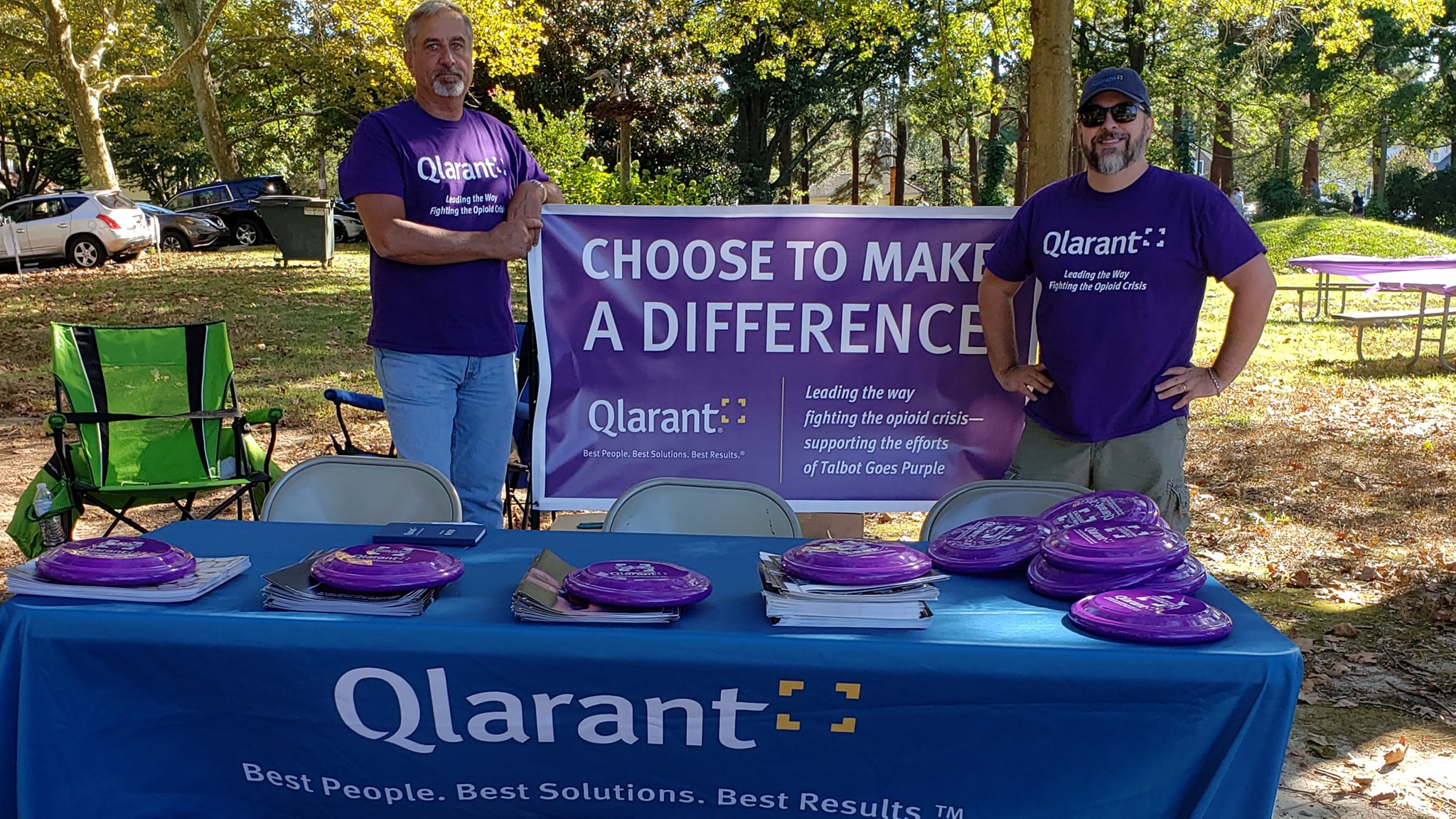 Two Qlarant Associates host a Recovery Month table at an Opioid Awareness event