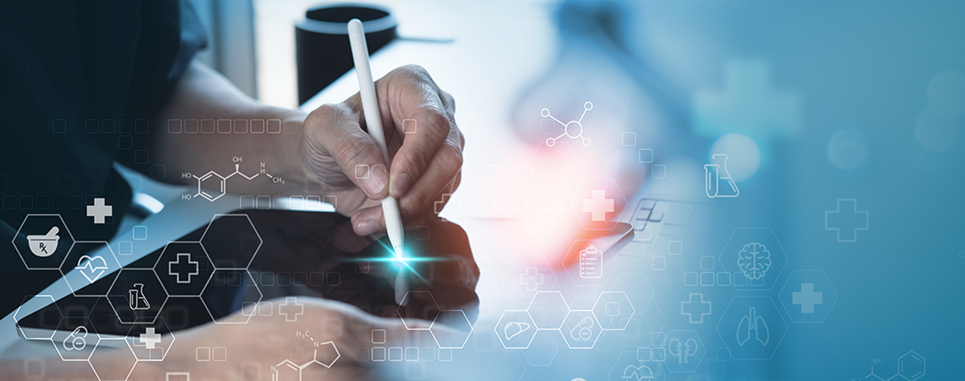 Hand writing on tablet with floating medical symbols overlaid